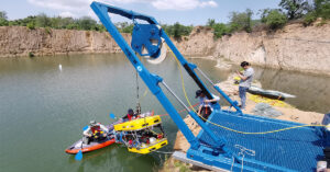 Our compact electric LARS (10kN SWL) performing a test deployment of an inspection-class ROV in a port or test facility.