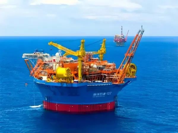 Explosion-proof winch and crane on offshore oil and gas platform.